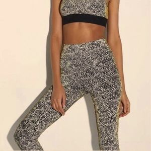 Black line Noli Yoga gold reflective leggings